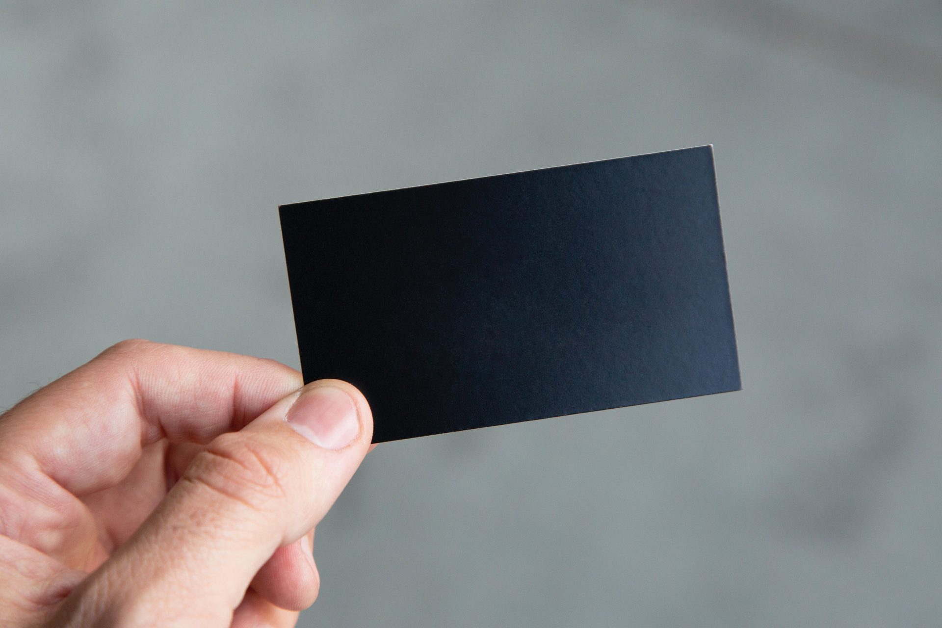 hand holding black business card with Membership Access System written across
