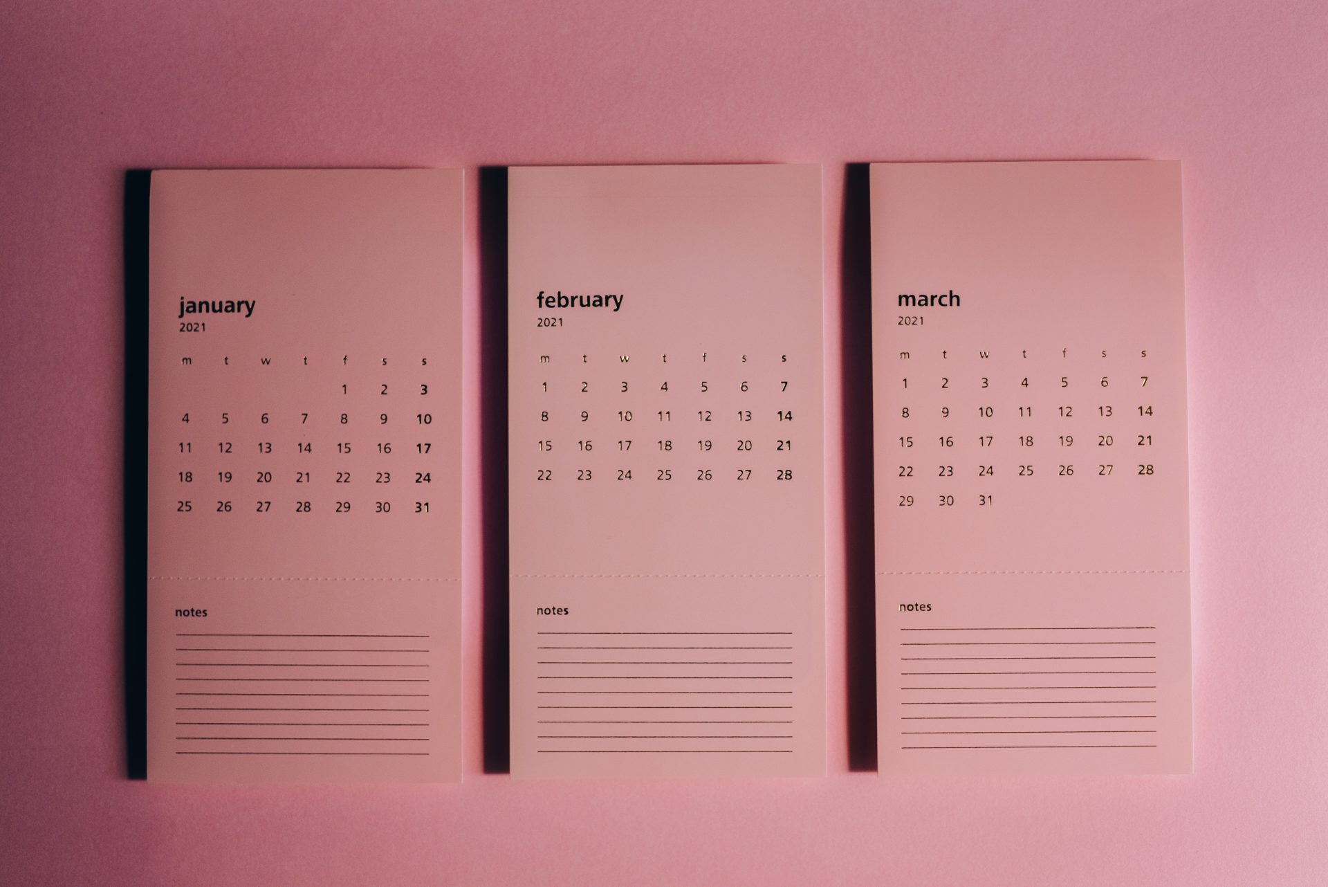 three calenders with notes written on them. Gliffen Content Management System written at center