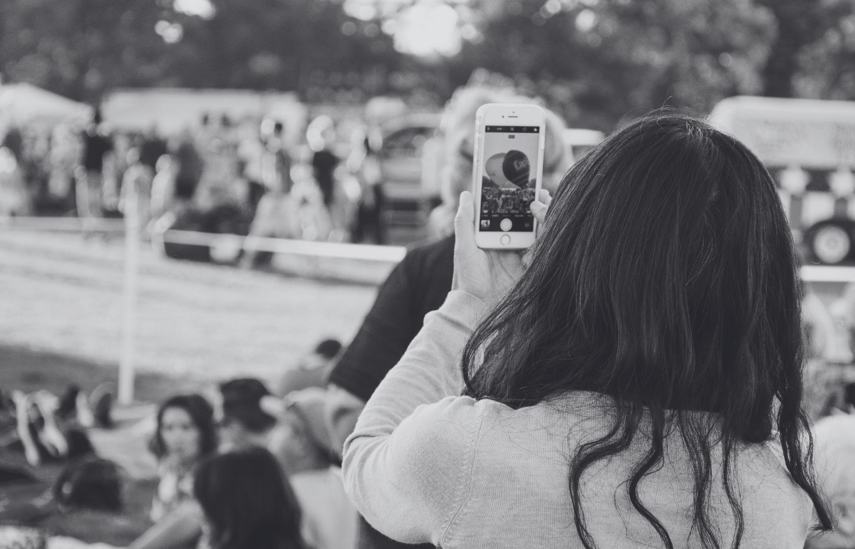 woman taking picture on her phone