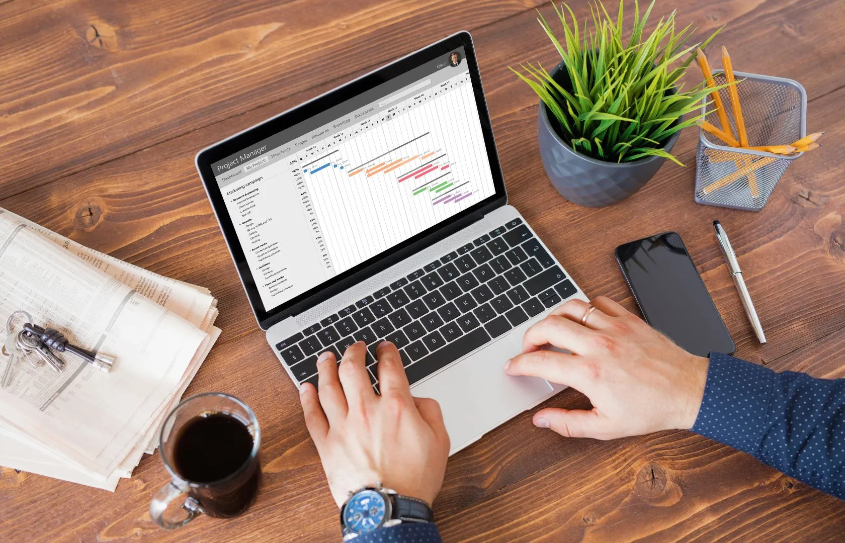 man using Content Management system on laptop