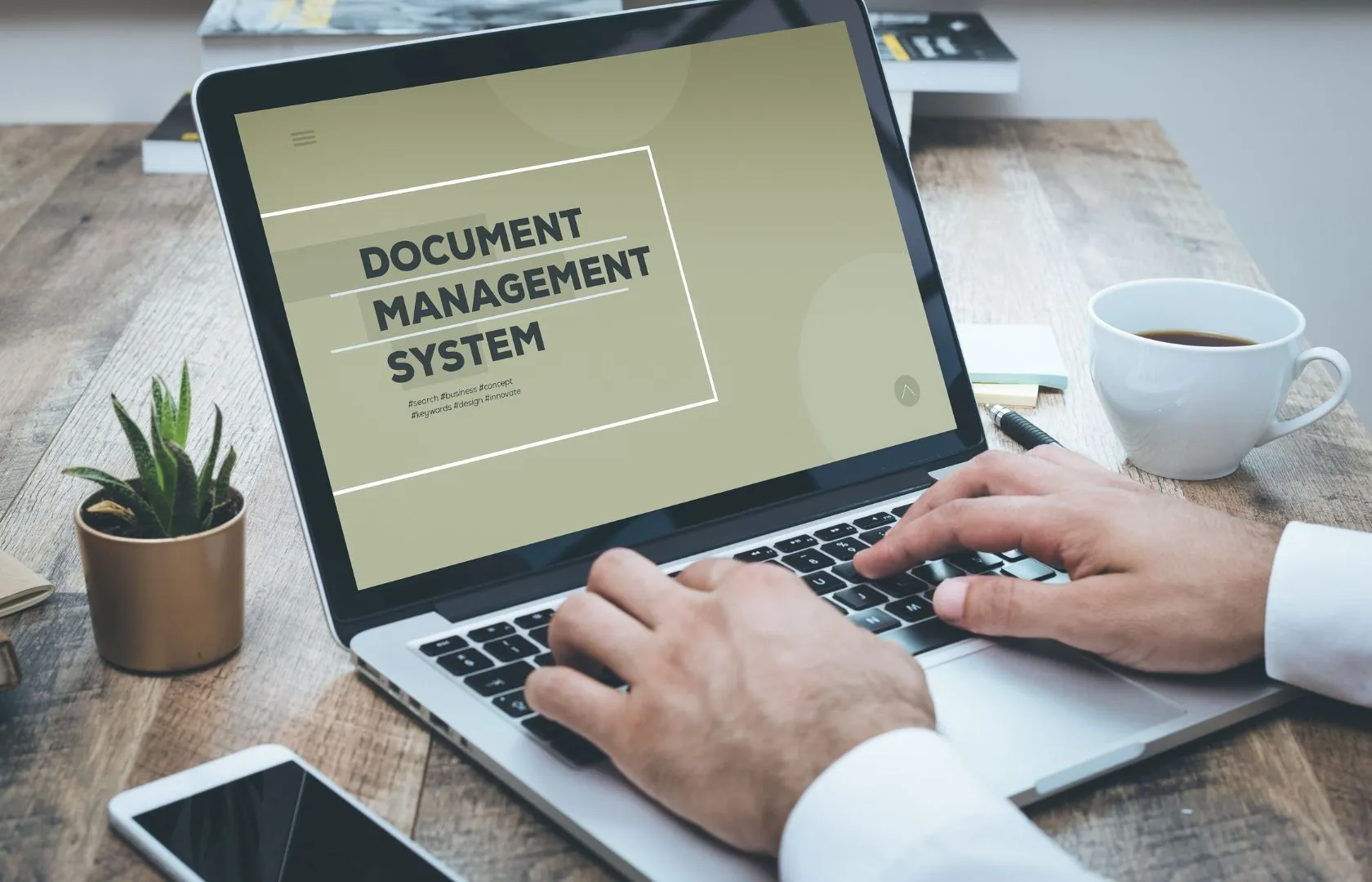 man using document and Content Management system on laptop