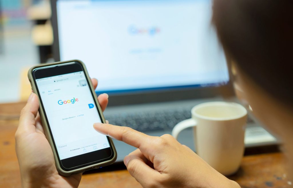 woman googling on her phone