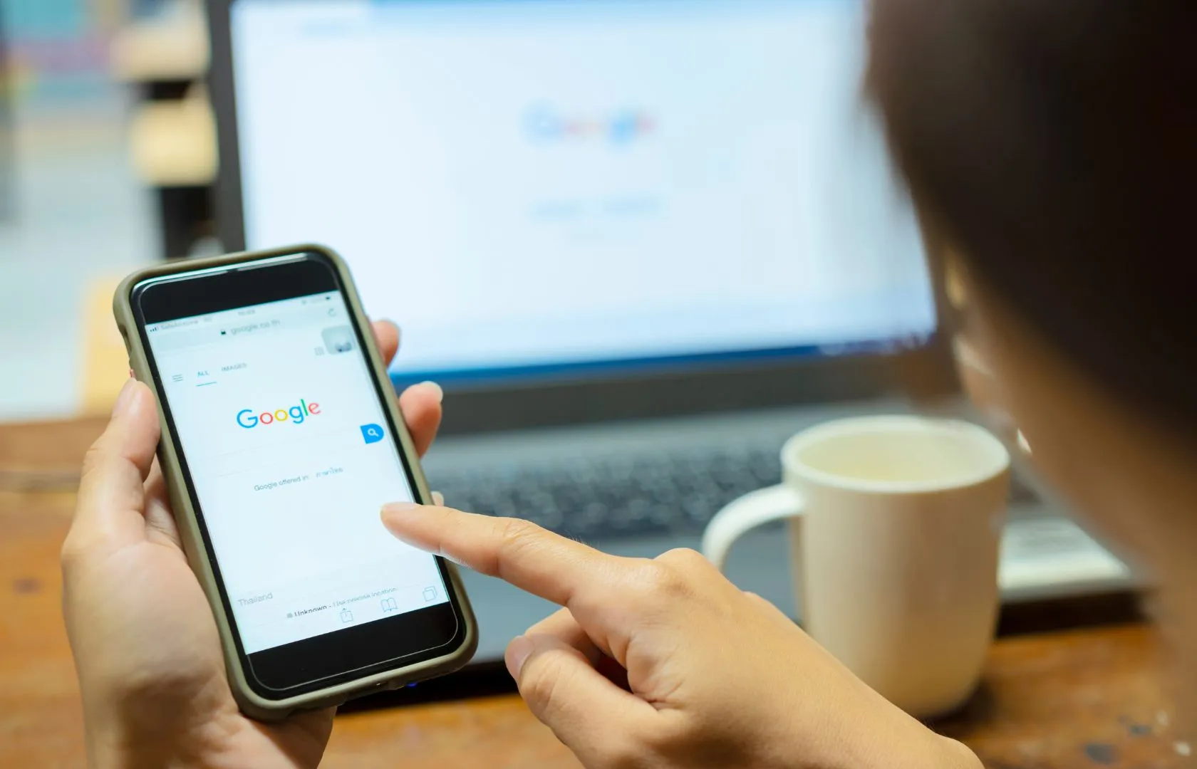 woman googling on her phone
